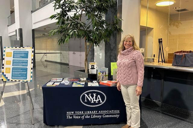 Friday April at NYLA registration desk – April Bliss