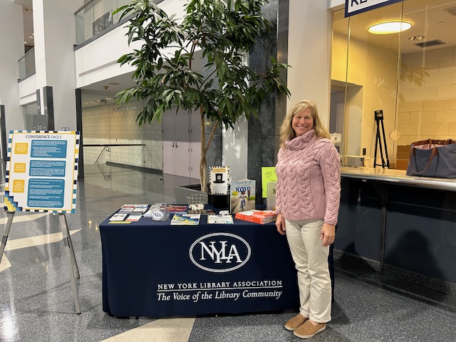 Friday April at NYLA registration desk – April Bliss